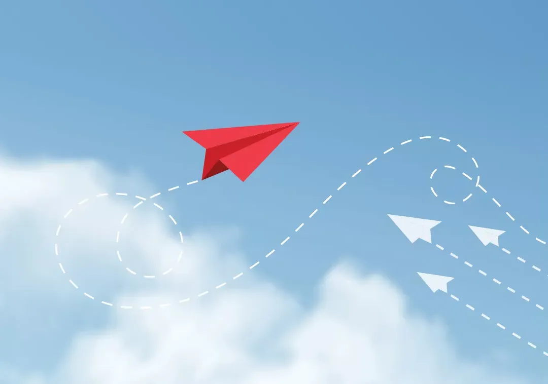 Illustration of paper airplanes, three going in one direction and a fourth going in a different one